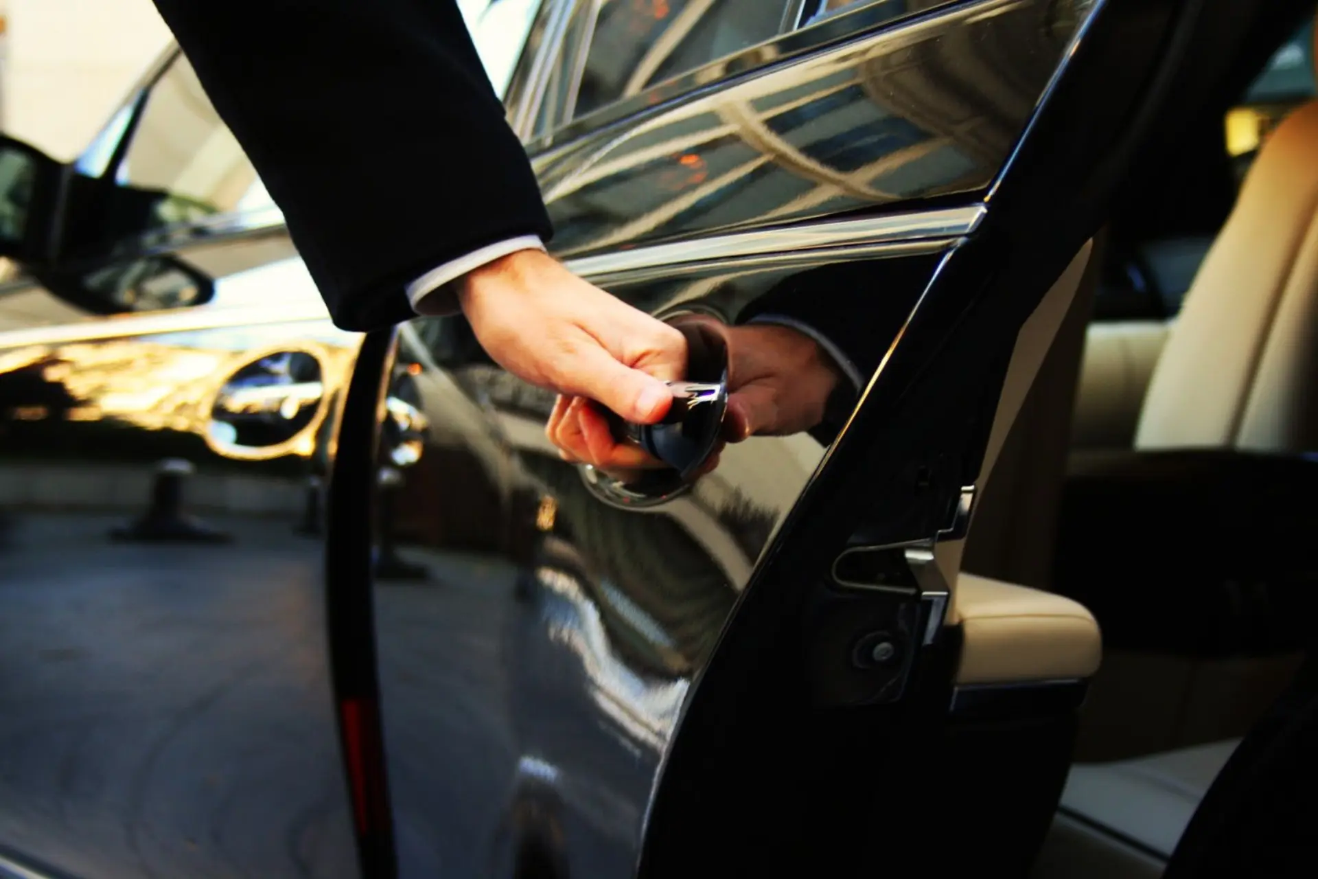 Traveller with luggage meeting a chauffeur — Irydn flight-tracked airport transfers between Windsor, California and STS, SFO, and OAK